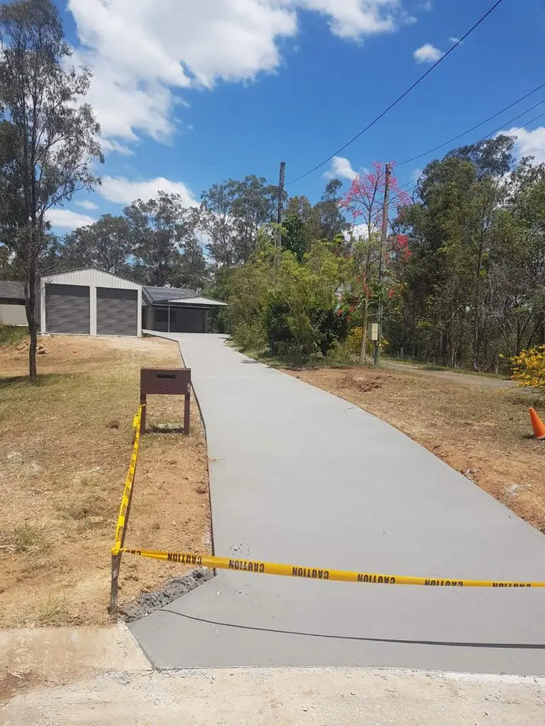 Freshly poured plain concrete driveway