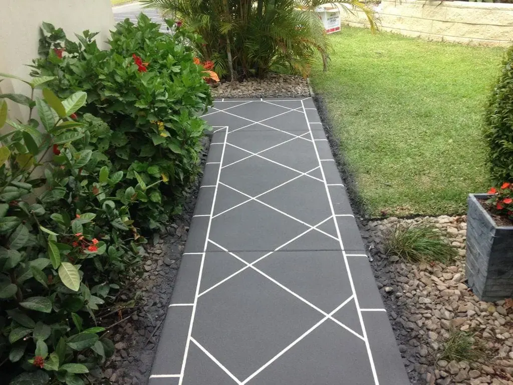 Garden path resurfaced in charcoal with a white diamond pattern and border