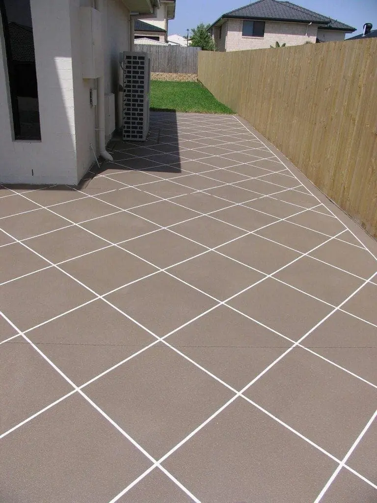 Side path resurfaced in a mocha diamond-tile pattern