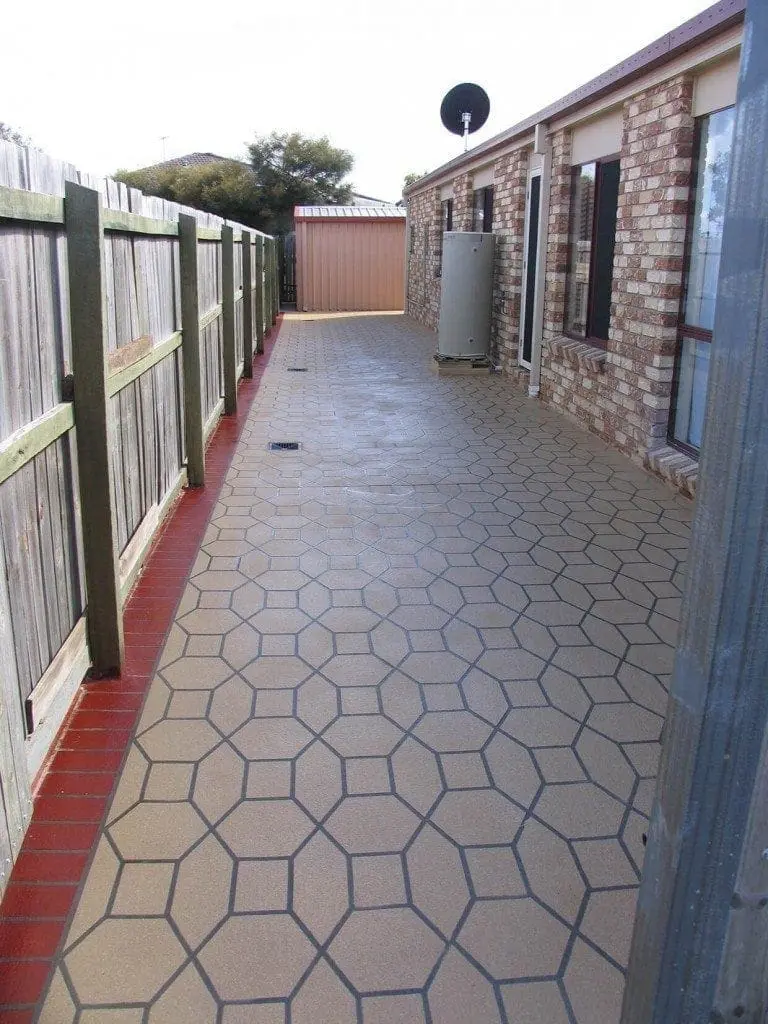 Side path resurfaced in a sandstone hexagon pattern with a red edge