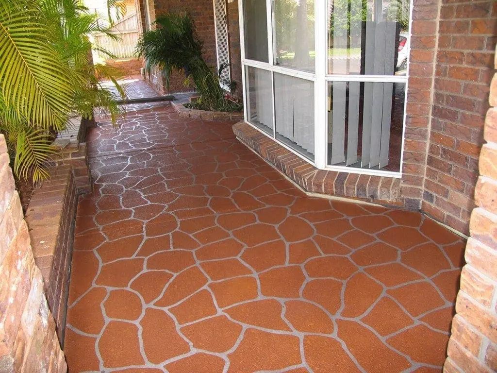 Front entry resurfaced in a red bush-rock crazy-pave pattern