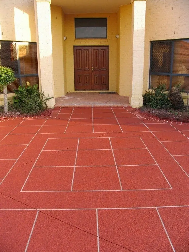 Front entry resurfaced in a red tile pattern with white grout
