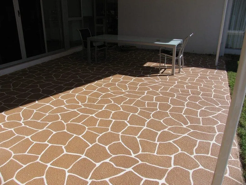 Patio resurfaced in a sandstone crazy-pave pattern