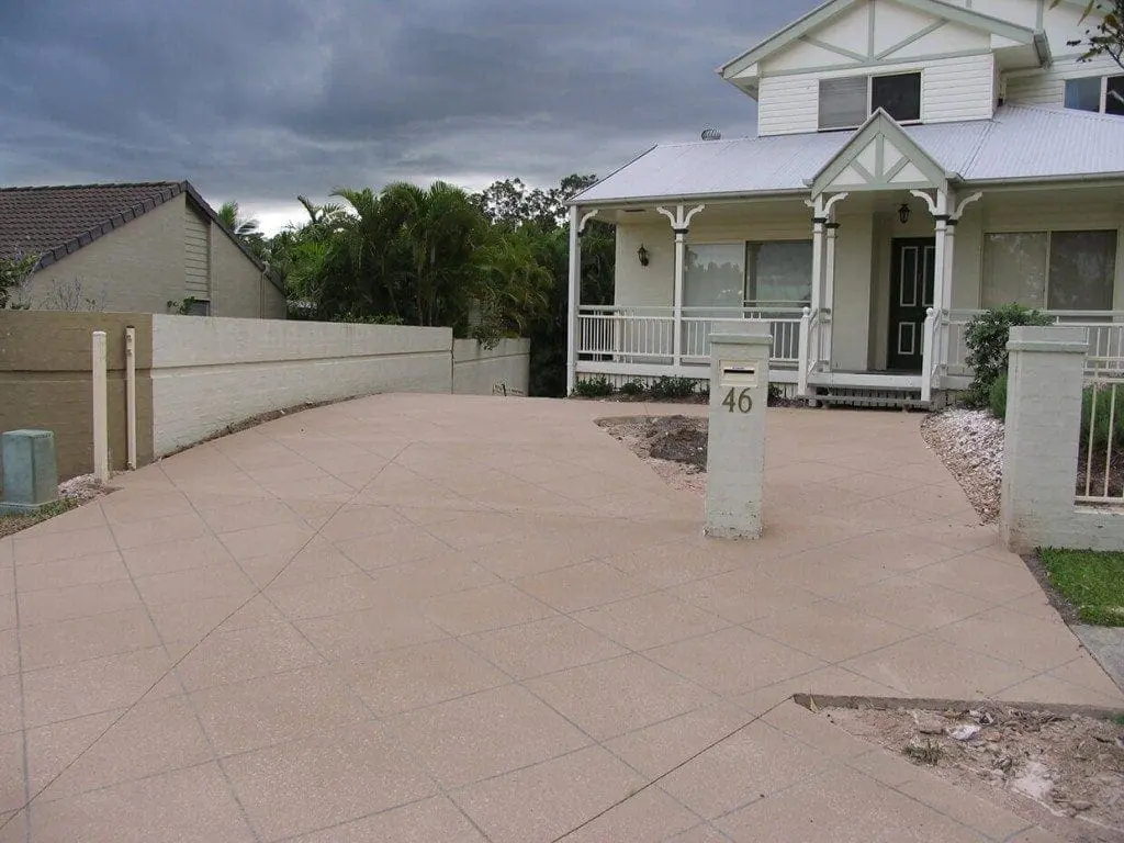 Wide driveway resurfaced in a sandstone diamond-tile pattern