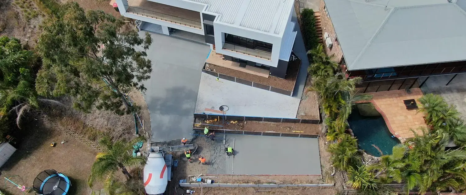 Aerial view of a new concrete driveway and slab at a Gold Coast hillside home